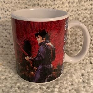 Elvis Presley dressed in black leather on mug.